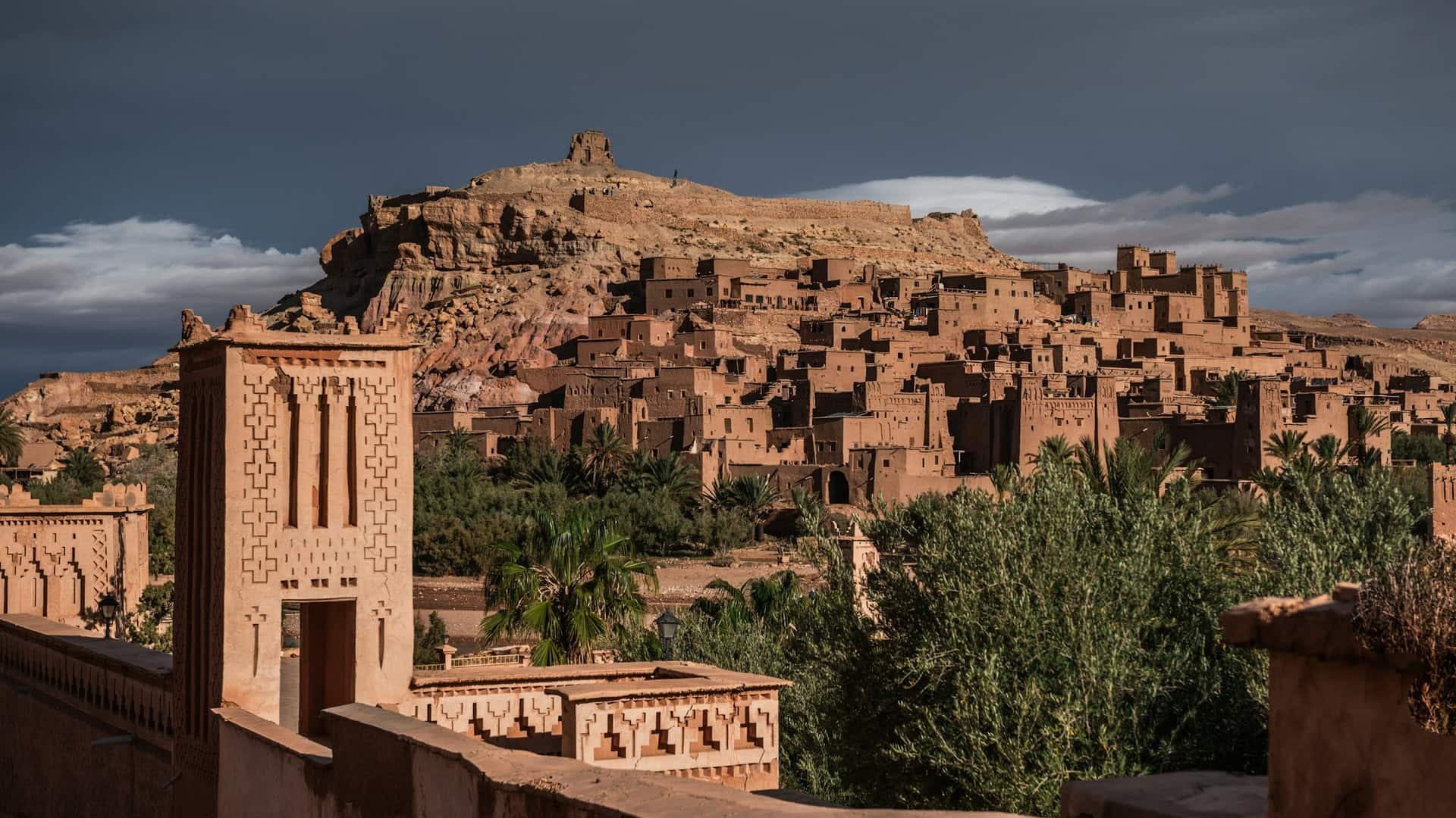 The ksar of Aït Ben Haddou climbing its hillside, earthen houses and towers below the granary at the summit.
